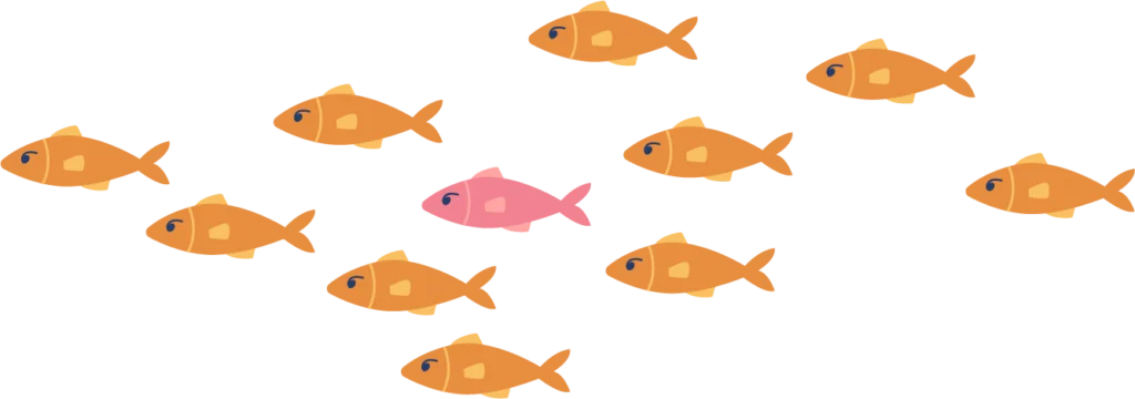 School of orange fish with one pink fish
